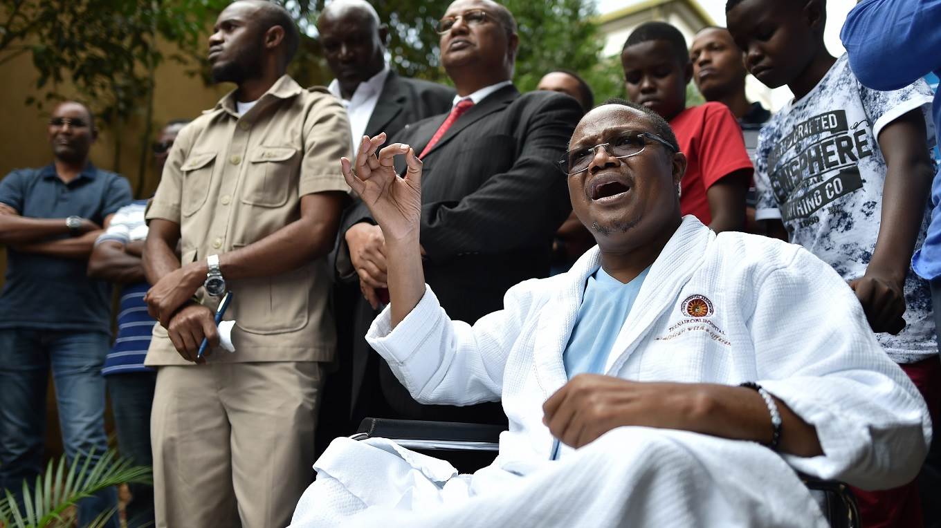 Tanzanian main opposition chief Tundu Lissu gestures from his wheelchair