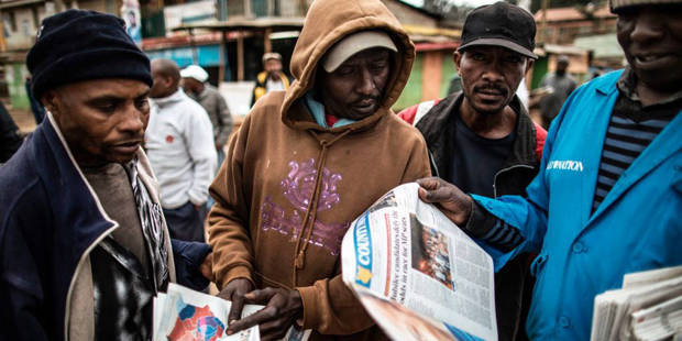 men reading newspapers kenya