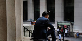 man sitting NYSE financial crisis