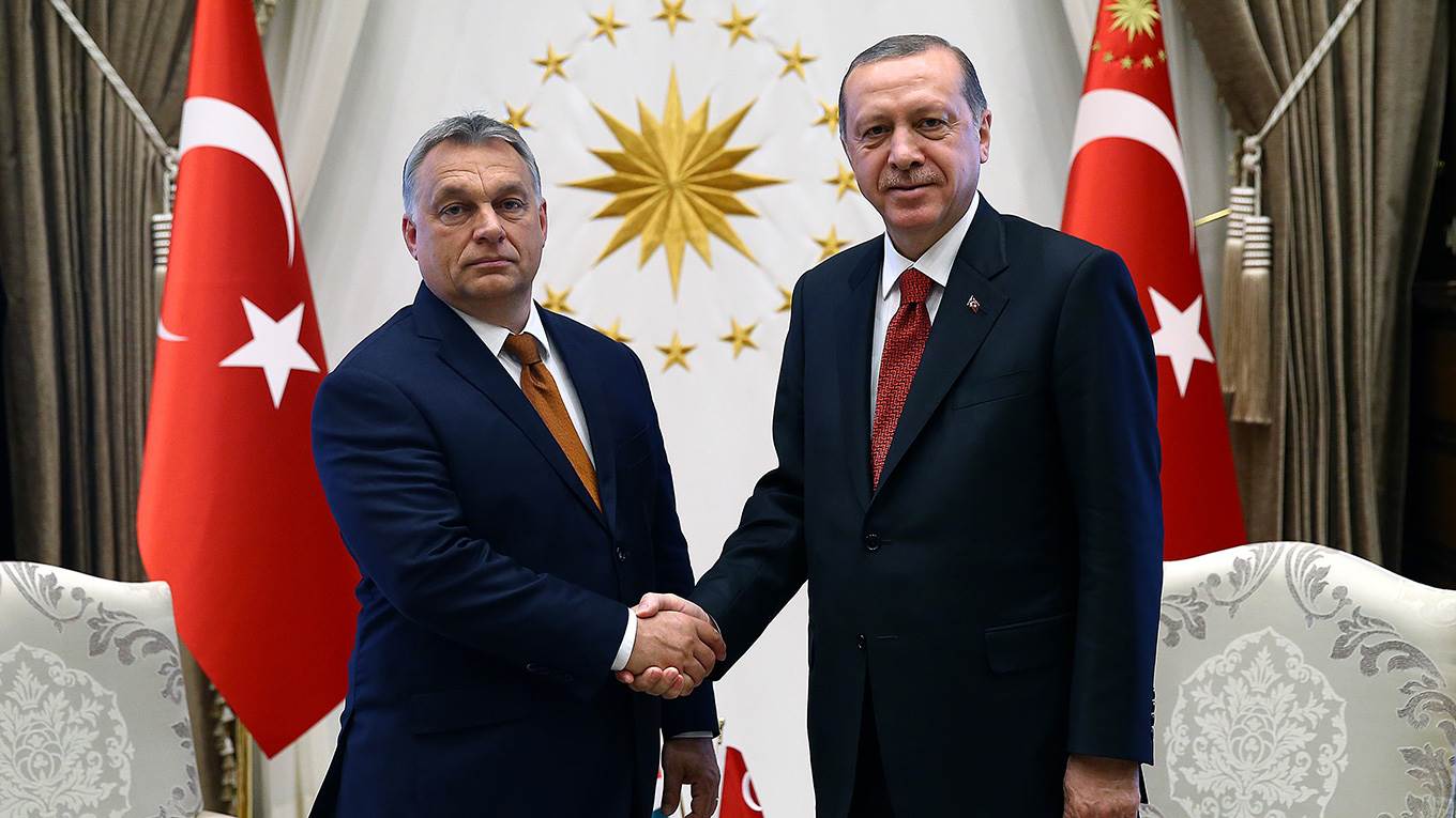 Recep Tayyip Erdogan shakes hands with his Hungarian counterpart