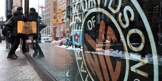 A Harley Davidson sign is displayed in a window at the New York store 