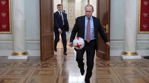 Russian President Vladimir Putin playing with an official match ball for the 2017 FIFA Confederations Cup