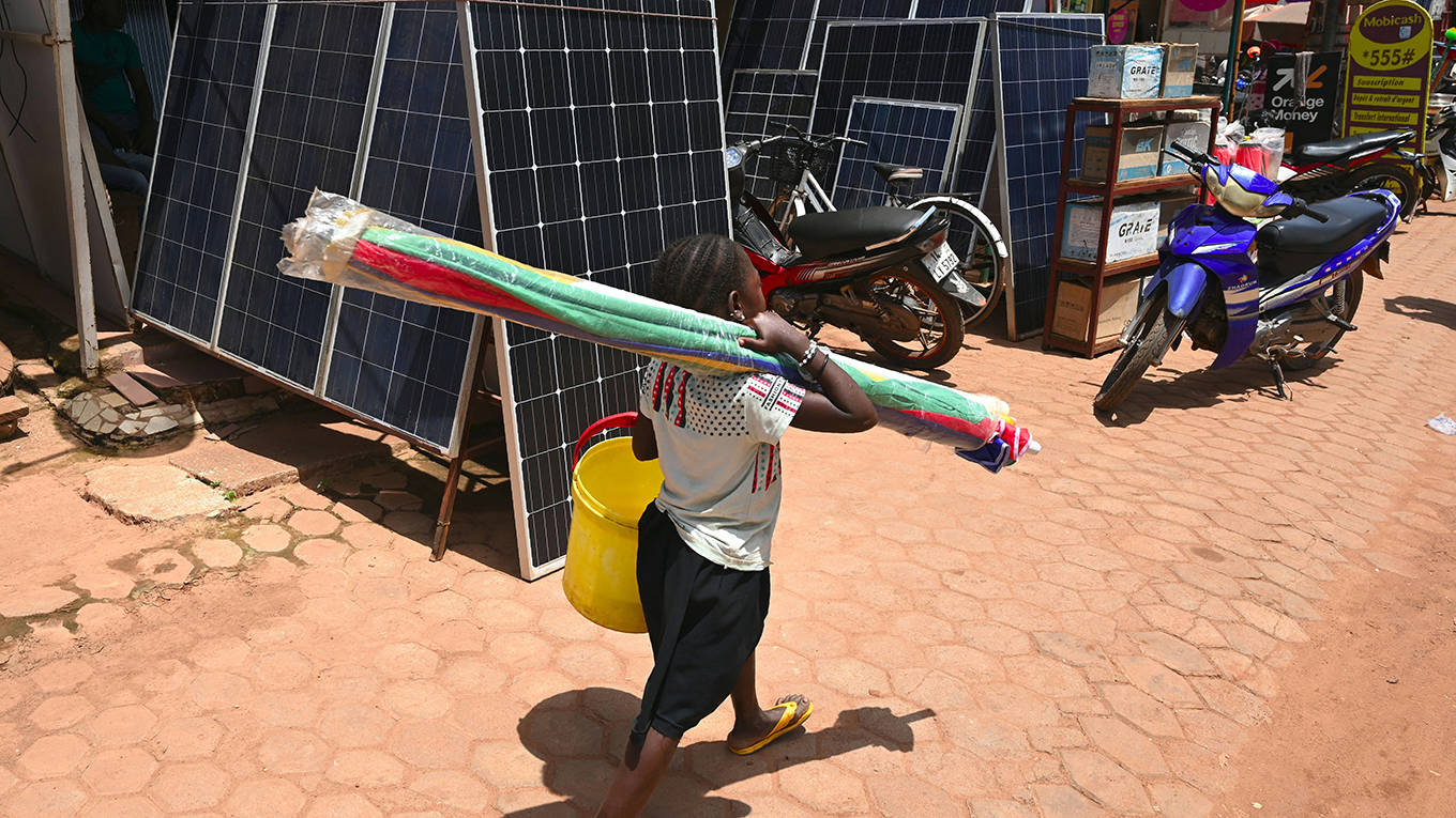 lawson1_ISSOUF SANOGOAFP via Getty Images_africagirlsolarpanel