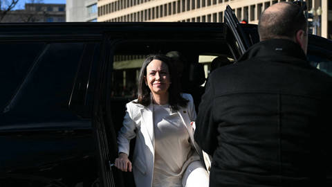 Venezuelan opposition leader María Corina Machado steps out of a vehicle near the White House in Washington, D.C., ahead of a scheduled meeting with U.S. President Donald Trump on January 15, 2026.