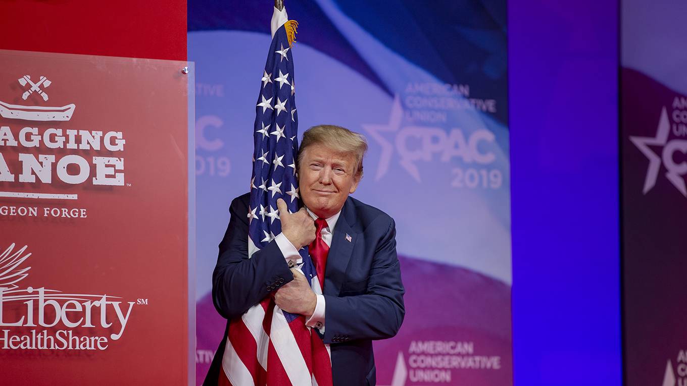 nye199_Tasos KatopodisGetty Images_trumphugUSflag