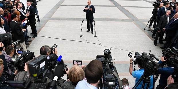 Russian President Vladimir Putin speaks with journalists 