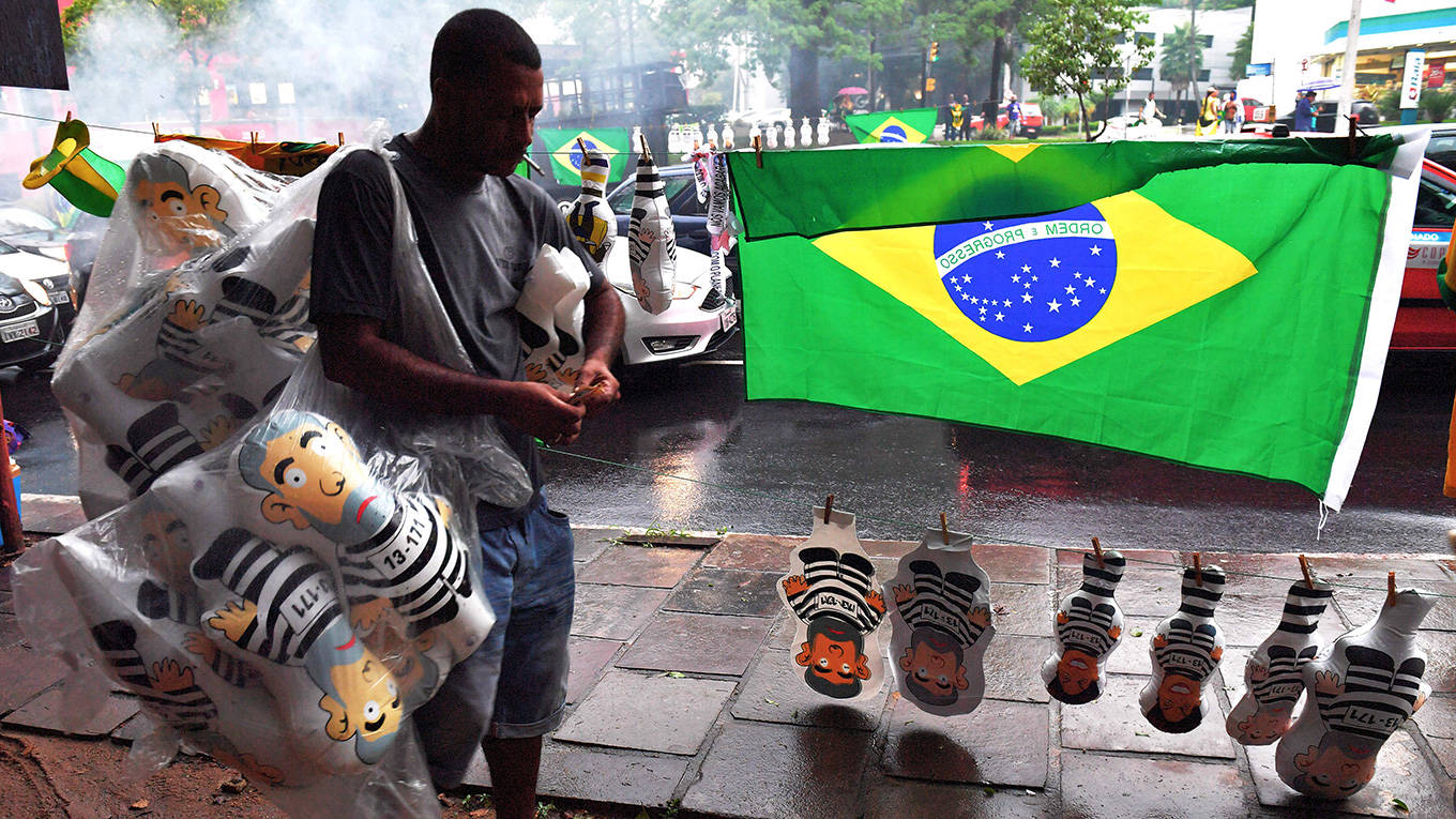 A vendor sells inflatable dolls depicting former Brazilian president Luiz Inacio Lula da Silva