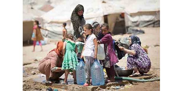 Iraqi Refugees in Kurdistan carry Water
