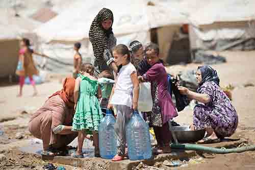 Iraqi Refugees in Kurdistan carry Water