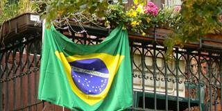 Flag of Brazil hanging on terrace.