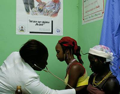 Woman doctor exams women