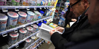 Members of France’s Directorate-General for Competition, Consumer Affairs and Fraud Control (DGCCRF) inspect baby milk products at a pharmacy in Orleans, France, on January 11, 2018.