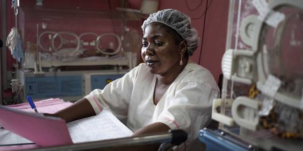 A nurse takes care of incubators at the premature baby ward of the pediatric hospital in Bangui