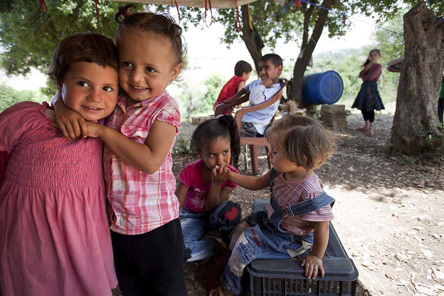Child refugees from Syria playing in a camp.