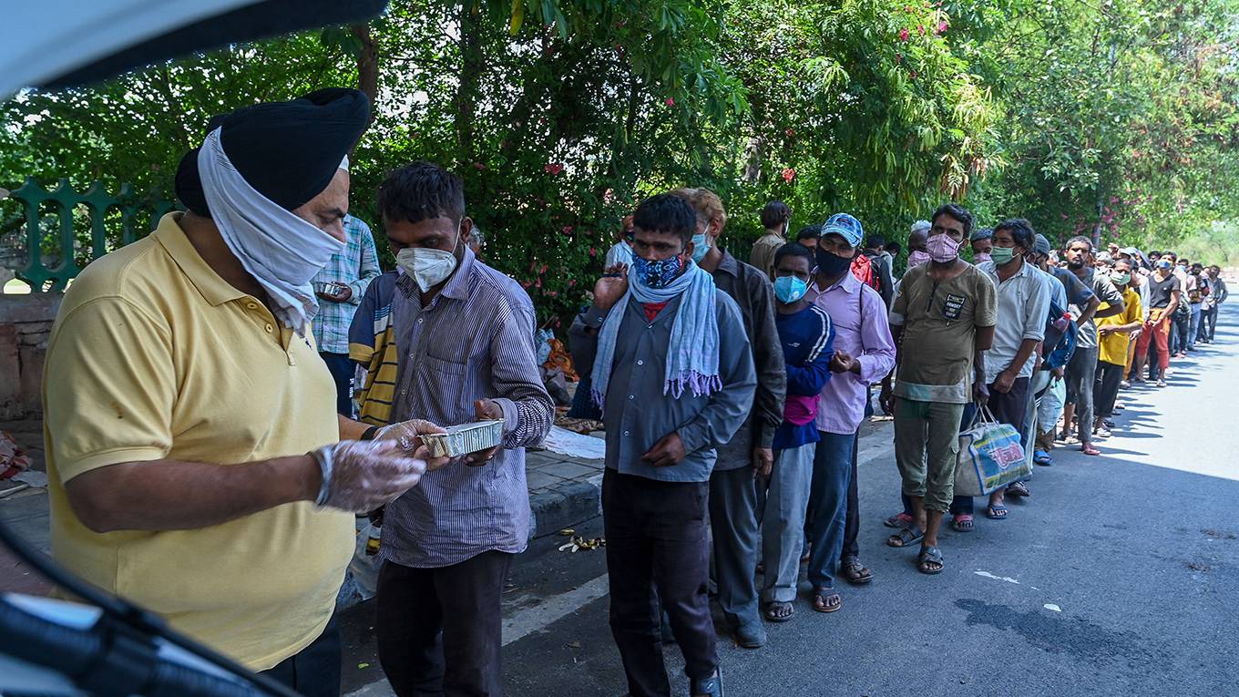basu68_PRAKASH SINGHAFP via Getty Images_indiacovideconomy