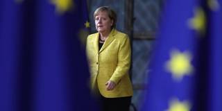 Angela Merkel	arrives for the European Union leaders summit