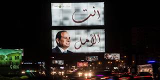 A giant election campaign board supporting Egyptian President Abdel Fattah al-Sisi i
