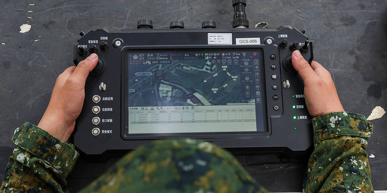 Taiwanese soldier operates a remote controller for a tactical surveillance drone during a military exercise in Taichung, Taiwan.
