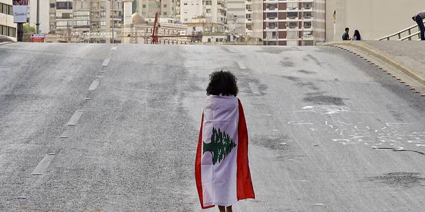 tannock37_JOSEPH EIDAFP via Getty Images_lebanonprotestflaggirl