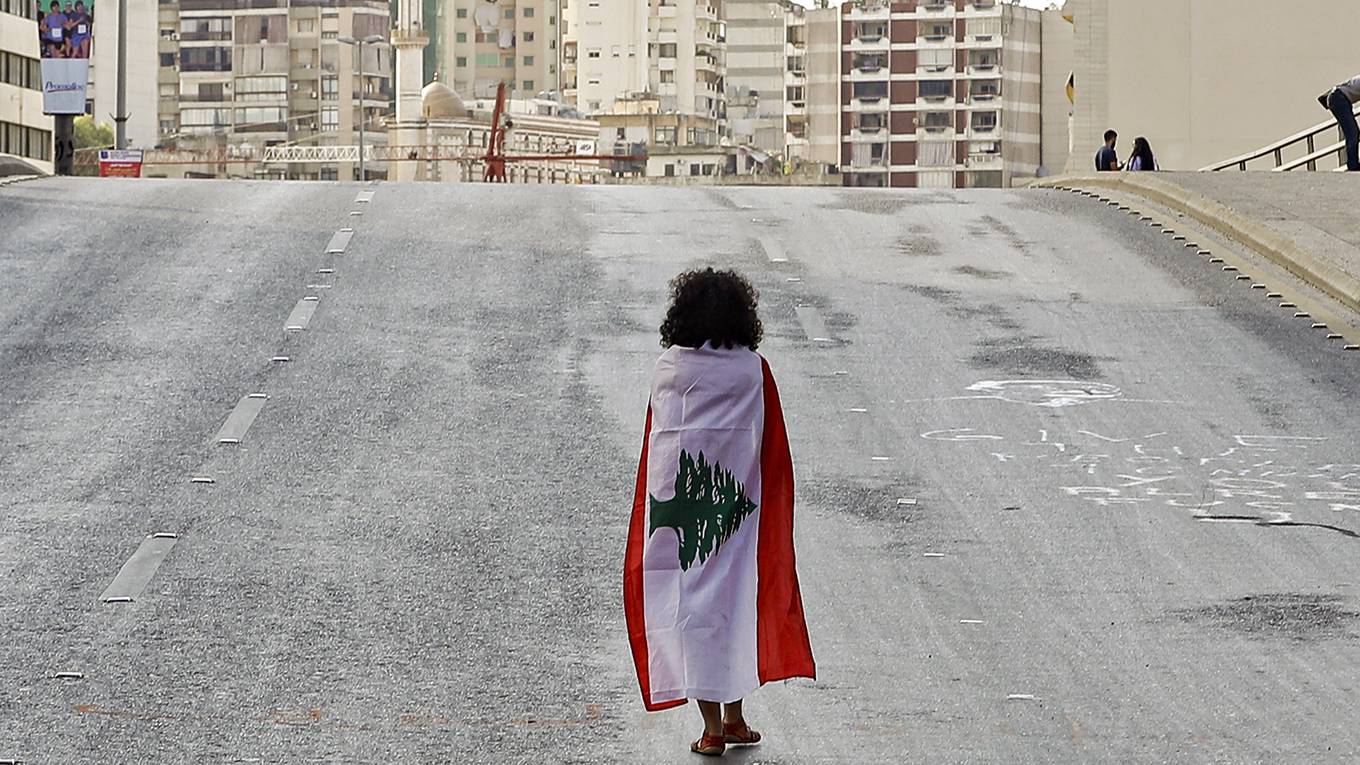 tannock37_JOSEPH EIDAFP via Getty Images_lebanonprotestflaggirl