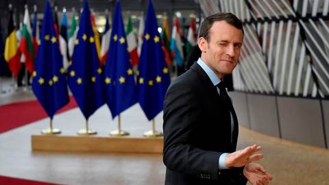  France's President Emmanuel Macron gestures as he arrives on the first day of a summit of EU leaders