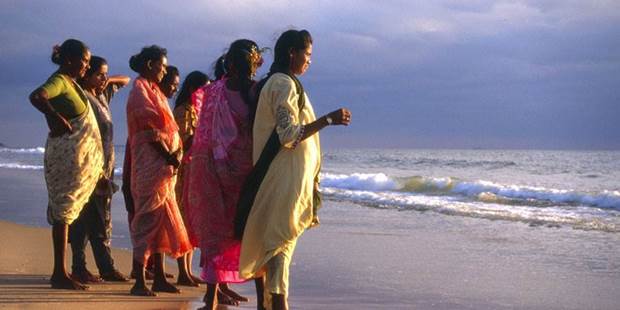 Indian women looking out over the ocean