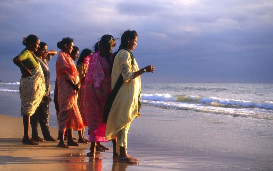 Indian women looking out over the ocean
