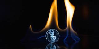 Coin under flame.