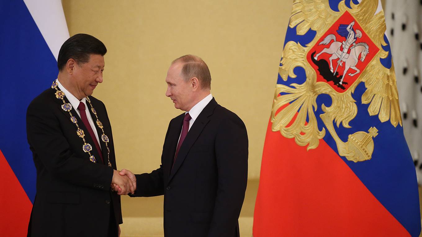 op_dervis1_Mikhail SvetlovGetty Images_PutinXiJinpingshakehands