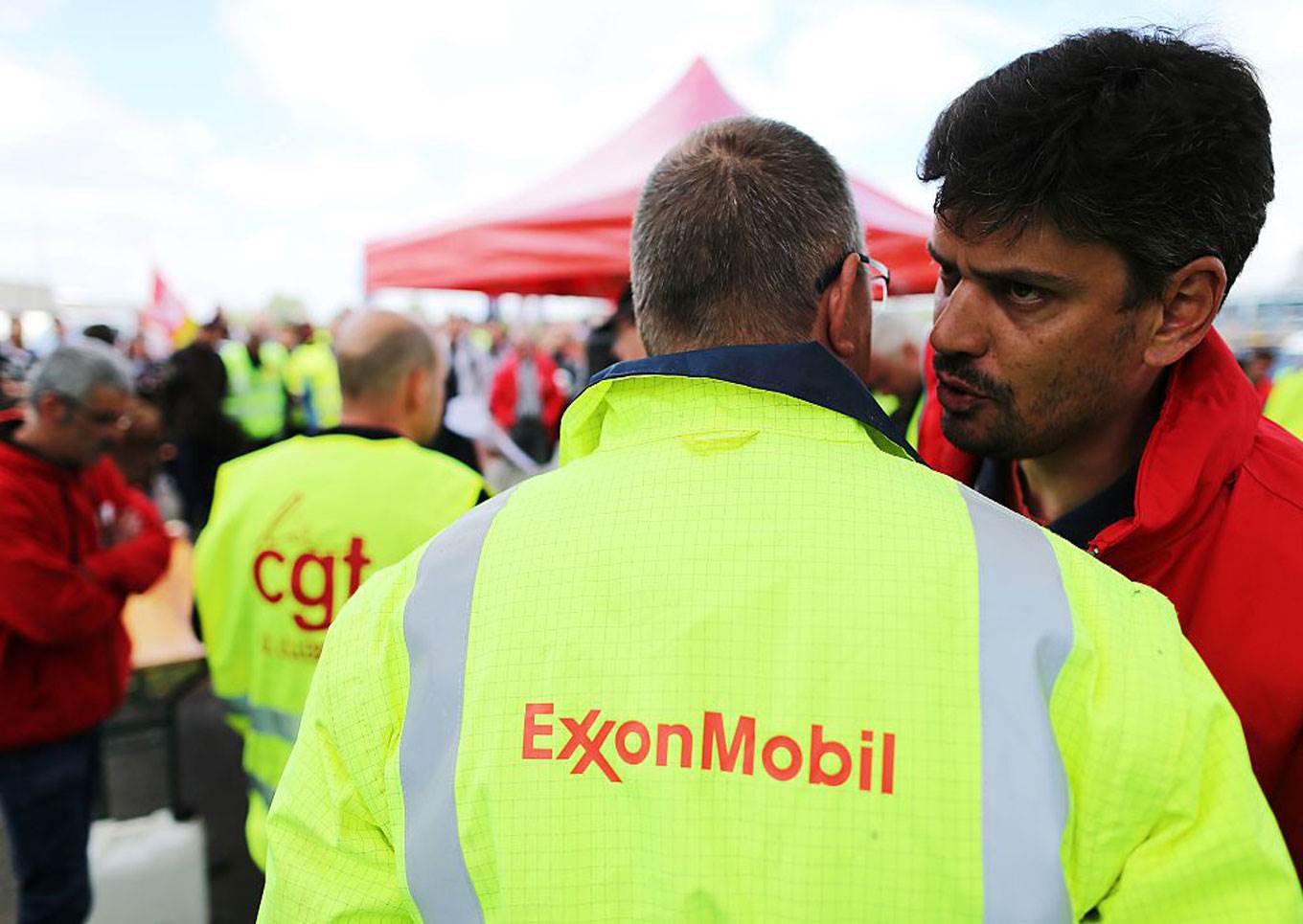 Exxon mobil men speaking