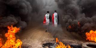 benami158_HUSSEIN FALEHAFP via Getty Images_iraqprotestfireflag