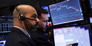  Traders work on the floor of the New York Stock Exchange