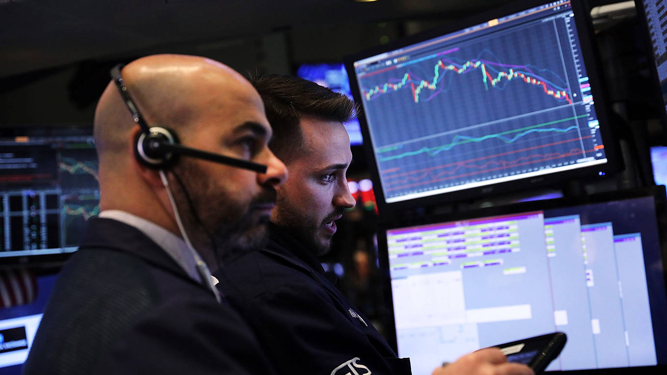 Traders work on the floor of the New York Stock Exchange