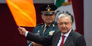 rogoff181_PEDROPARDOAFPGettyImages_mexicanpresidentwavingorangeflag