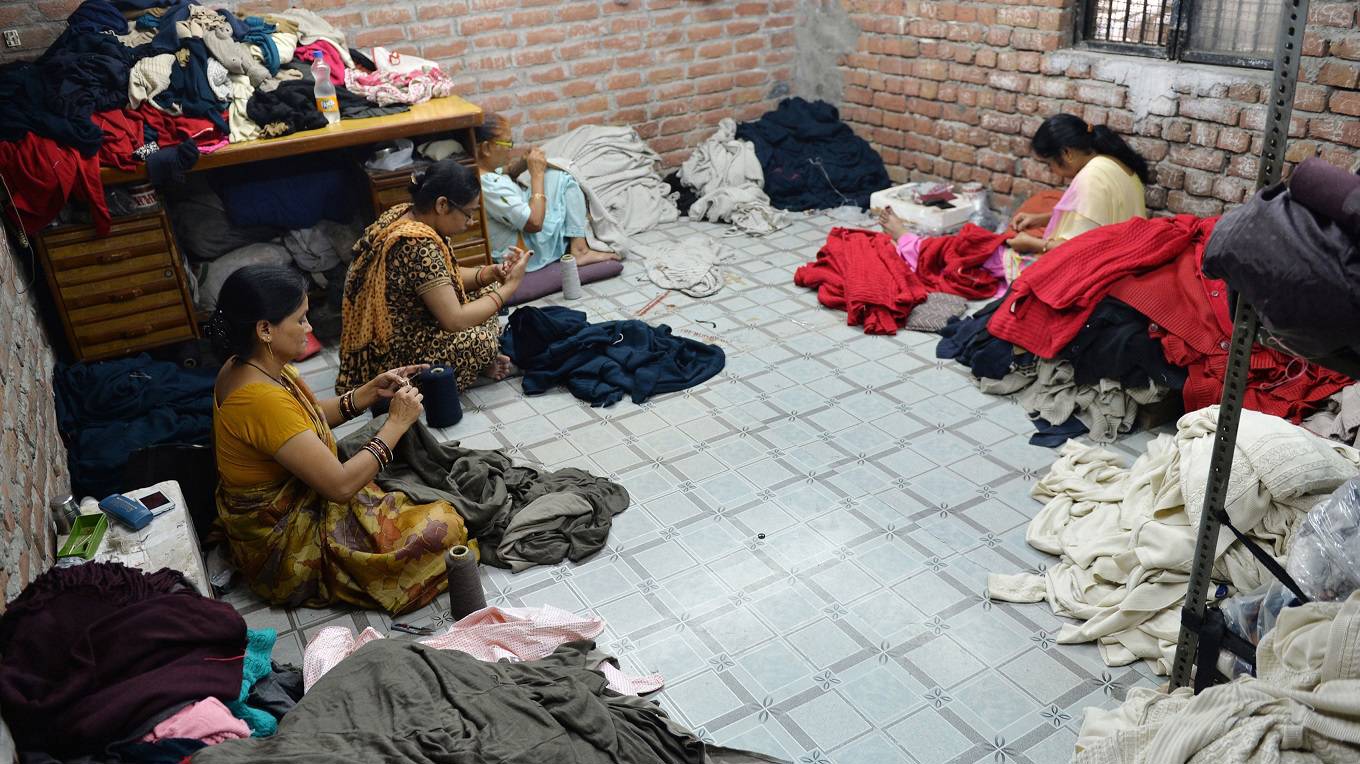 Indian women work at a garment factory in Ludhiana