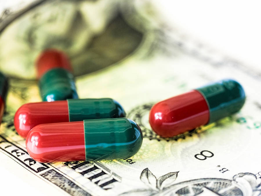 Pills on a US dollar bill