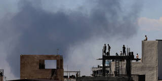 Residents watch from rooftops as smoke rises over Tehran after reported explosions on March 1, 2026, following a US and Israeli attack that killed Supreme Leader Ayatollah Ali Khamenei.