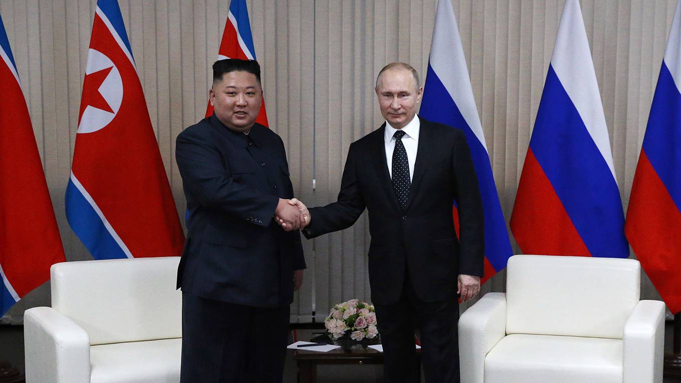 harrington17_MikhailSvetlovGettyImages_putinjongunshakehands