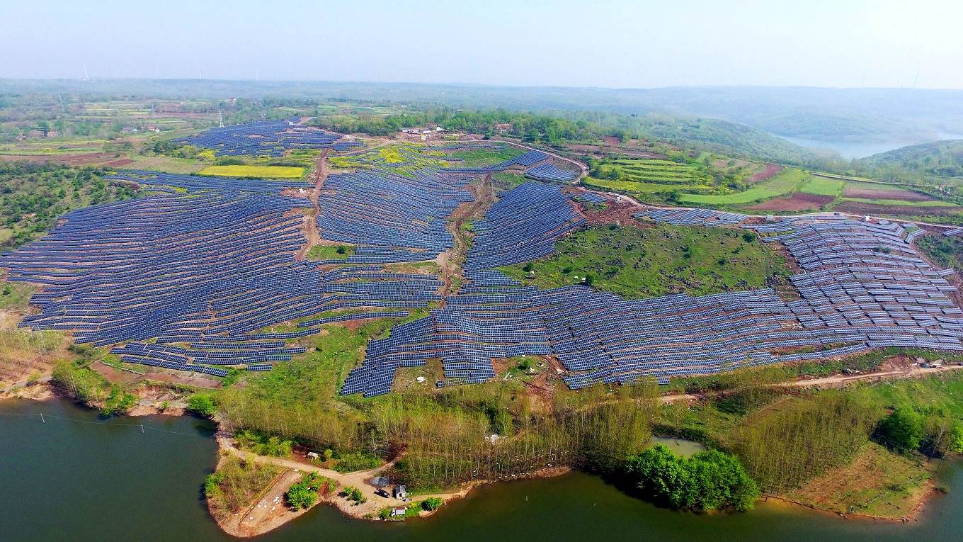Solar photovoltaic modules on a hillside in a village in Chuzhou