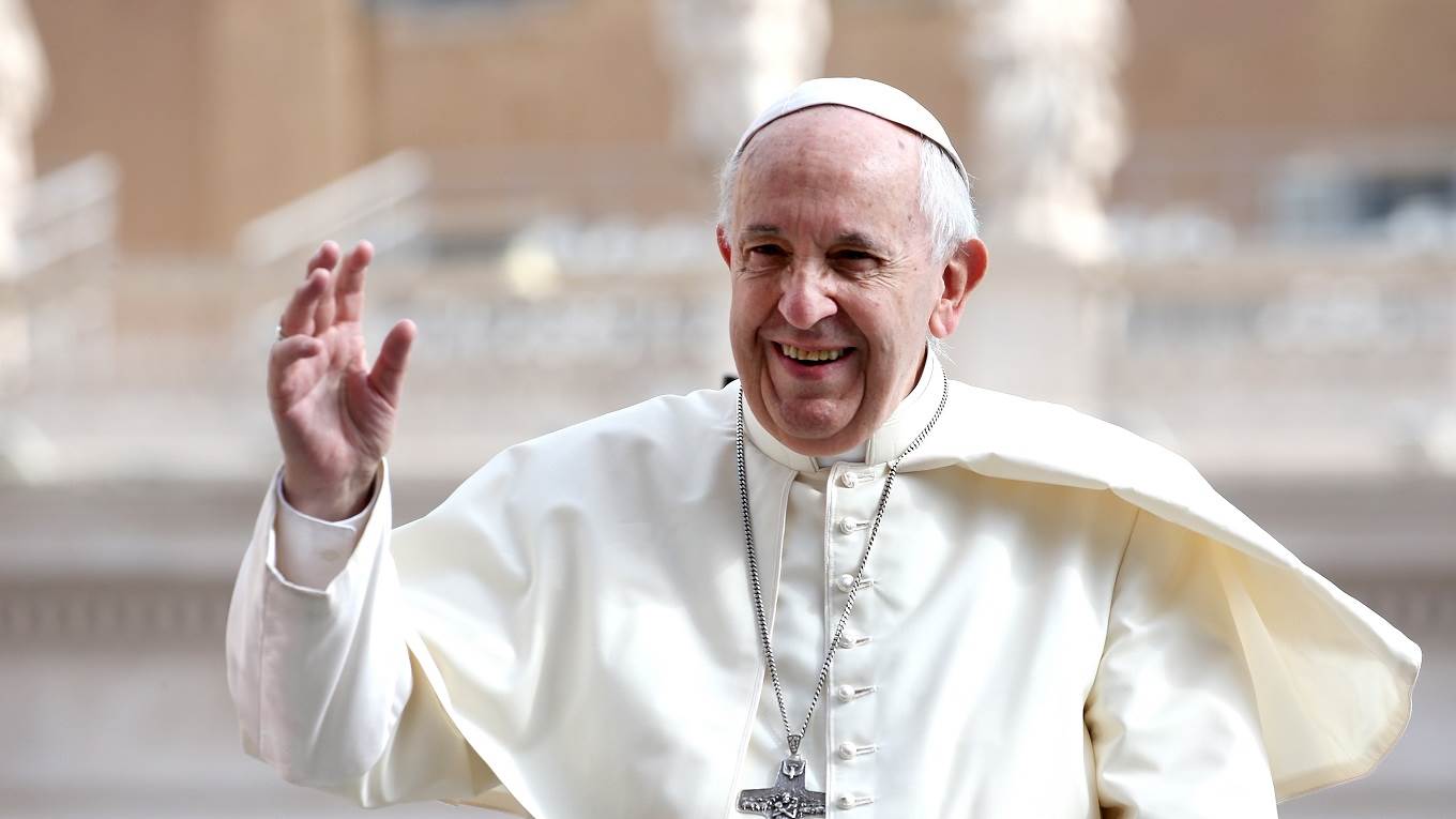 Pope Francis waves to the pilgrims gathered in St. Peter's Squar