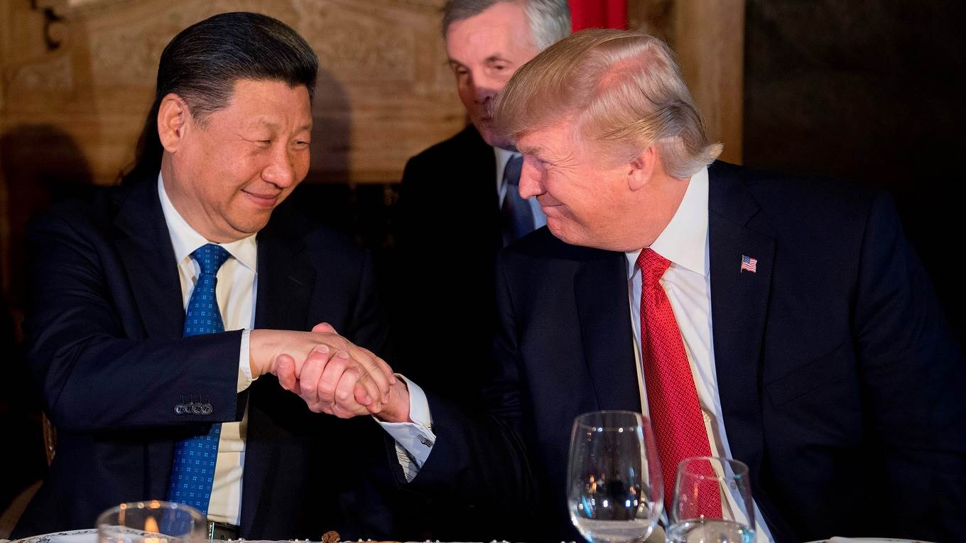 US President Donald Trump and Chinese President Xi Jinping shake hands