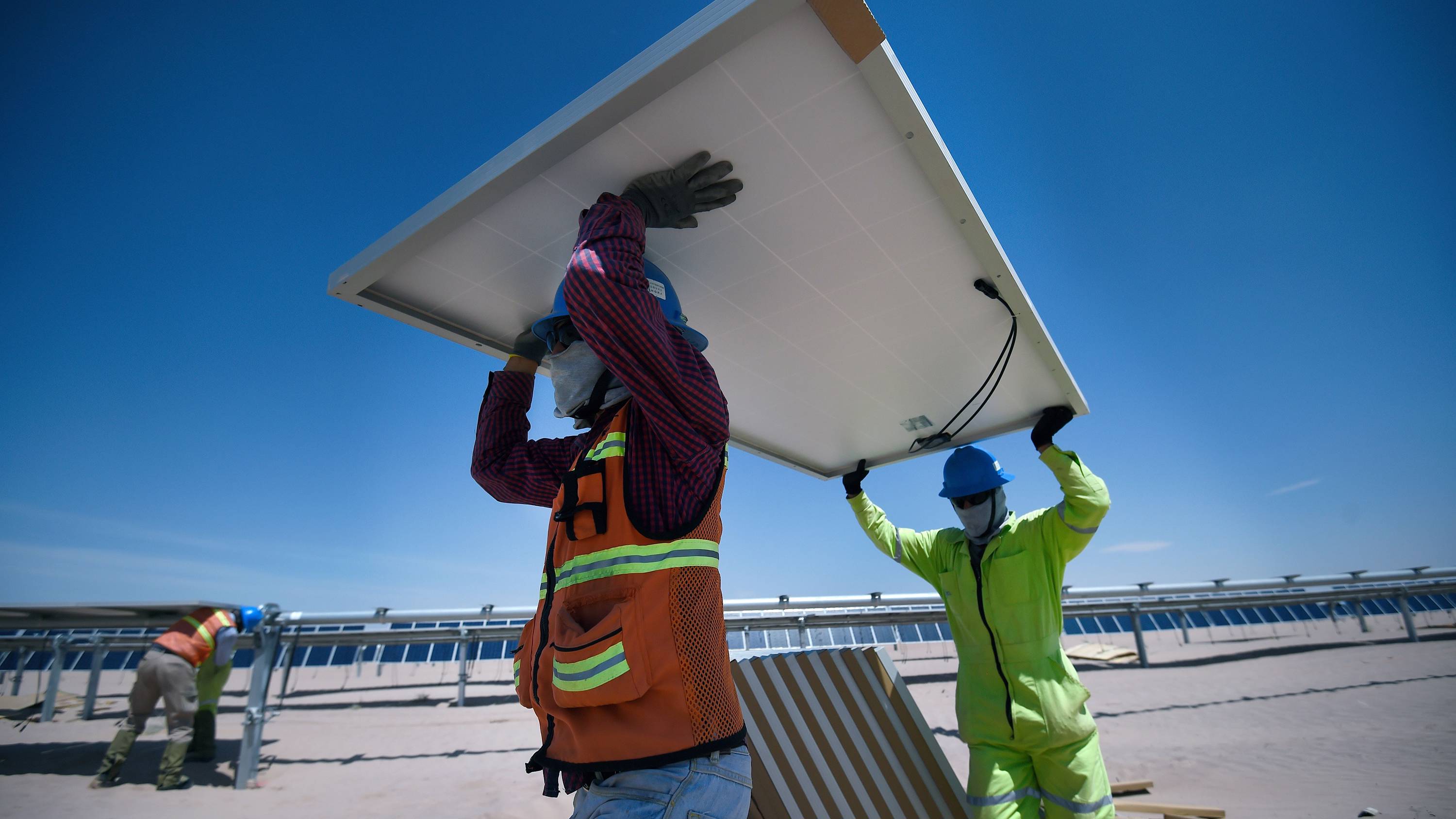 aboujaoude1_ALFREDO ESTRELLAAFP via Getty Images_solarpanelworkers