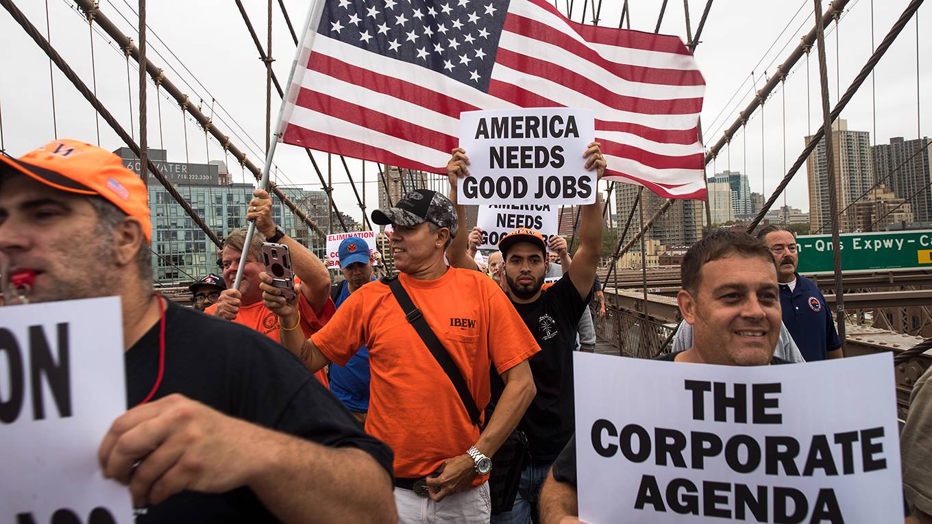 acemoglu18_Drew AngererGetty Images_usflagprotestjobs