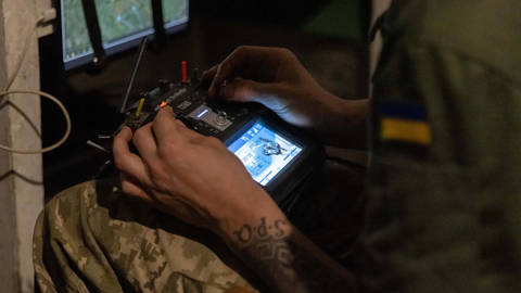 Ukrainian servicemen from the 116th Mechanized Brigade prepare interceptor drones designed to counter aerial threats during the war with Russia.