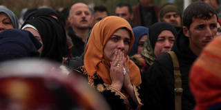 woman mourns syria