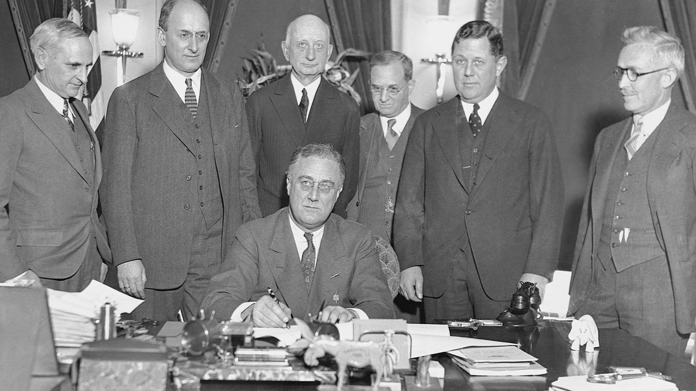 ​President Franklin D. Roosevelt​ signs the Gold Bill (also known as the Dollar Devaluation Bill) ​