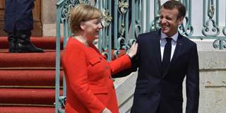 German Chancellor Angela Merkel welcomes French President Emmanuel Macron