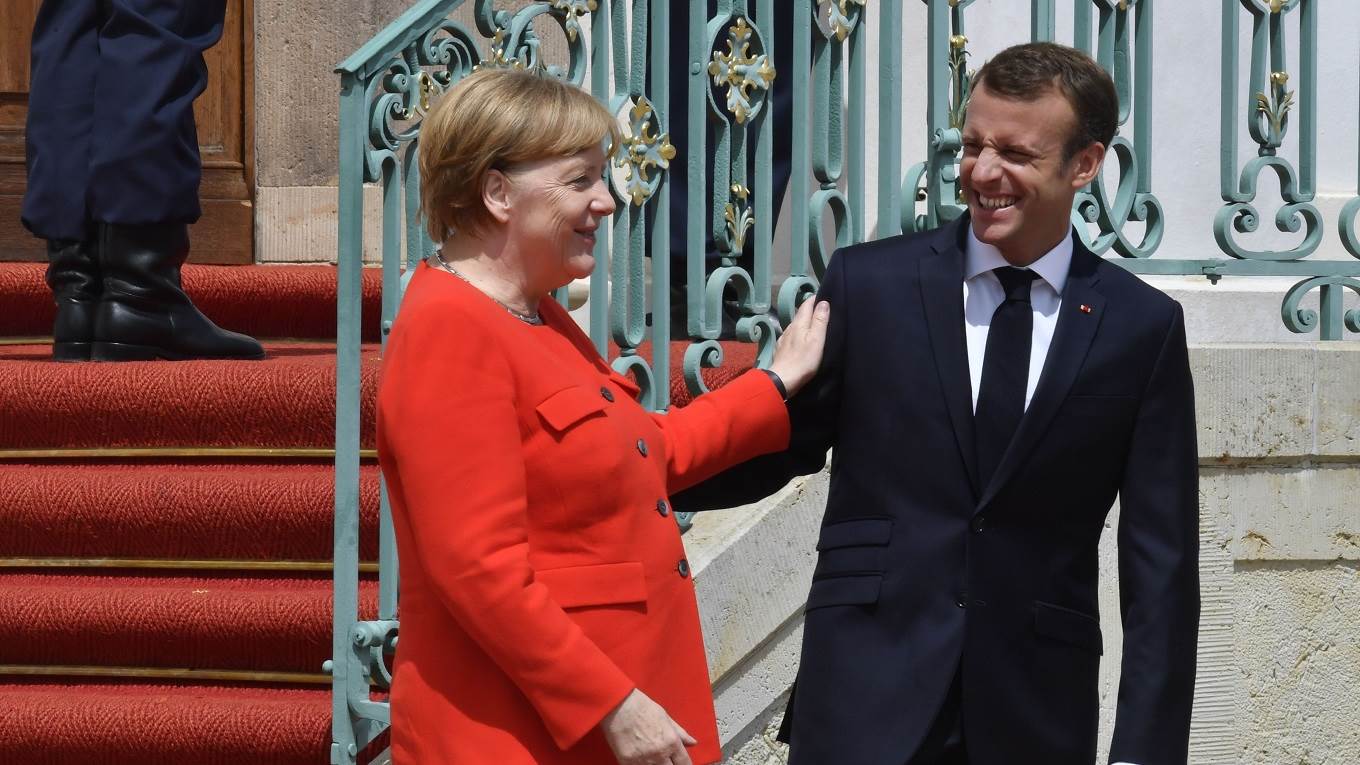 German Chancellor Angela Merkel welcomes French President Emmanuel Macron