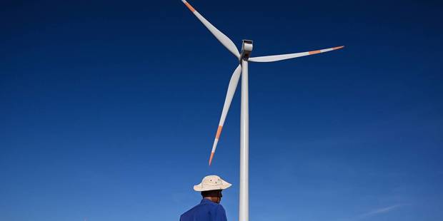 decroo1_MANAN VATSYAYANAAFP via Getty Images_wind turbine man
