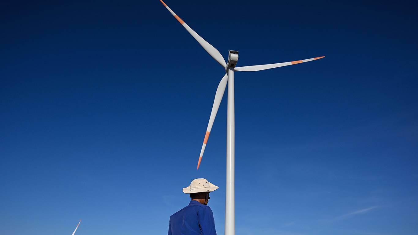 decroo1_MANAN VATSYAYANAAFP via Getty Images_wind turbine man